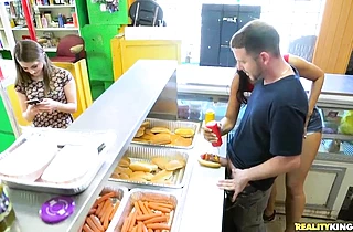 Sexy naked girl sucks and fucks a big wiener at the hot dog joint