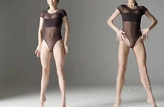 Two sexy twin sisters dancing and performing nude gymnastic exercises together