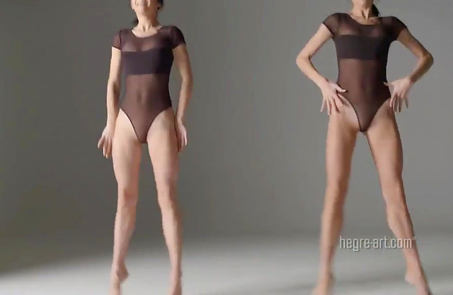 Two sexy twin sisters dancing and performing nude gymnastic exercises together