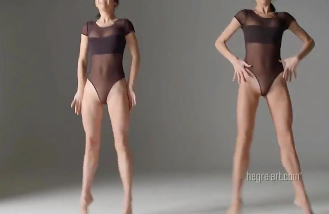 Two sexy twin sisters dancing and performing nude gymnastic exercises together