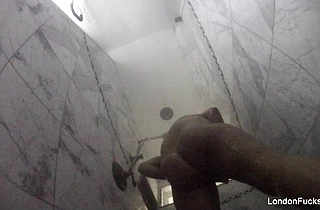 Naked girl takes a shower and rubs pussy without knowing about a hidden cam