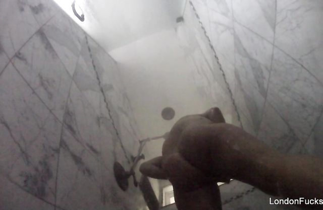 Naked girl takes a shower and rubs pussy without knowing about a hidden cam