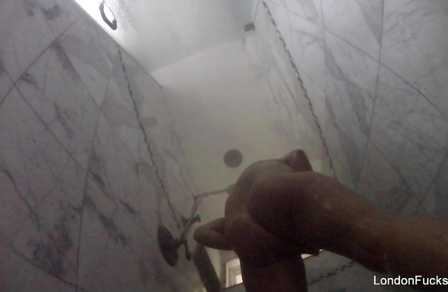 Naked girl takes a shower and rubs pussy without knowing about a hidden cam