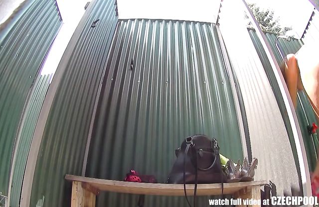 Watch this naked girl shower on the beach through a hidden camera