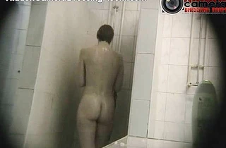 Woman is filmed while taking a shower through a hidden camera