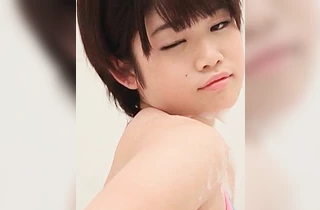 Nude Asian babe enjoys fingering the pussy under the shower