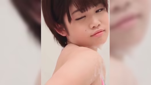 Nude Asian babe enjoys fingering the pussy under the shower