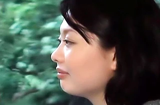 Busty Japanese seduced when taking a shower in the outdoor