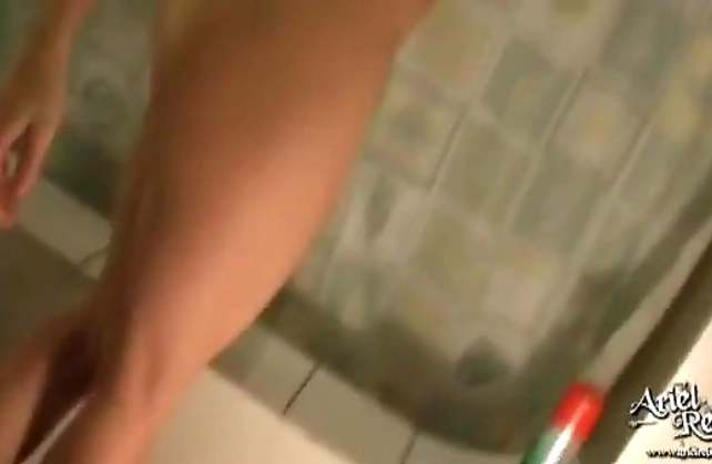 Aroused beauty takes undies down in the shower to pose fully naked