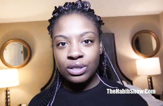 Smiling girl finally takes off black T-shirt and demonstrates naked tits