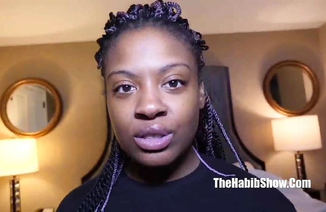 Smiling girl finally takes off black T-shirt and demonstrates naked tits