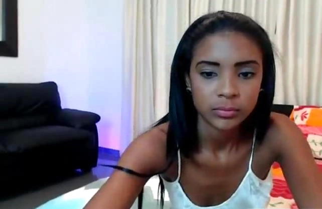 Winsome black camgirl seductively poses naked for her webcam fans