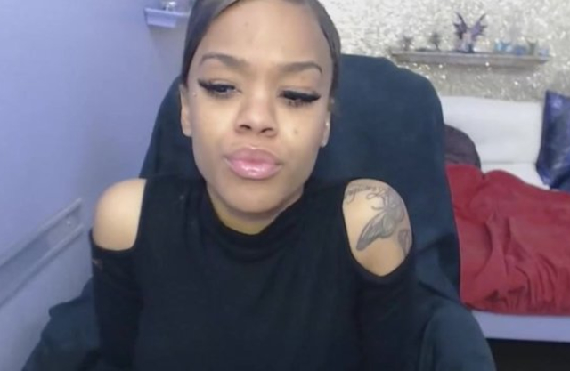 Stunning black teen sucks dildo before massaging naked sissy on cam