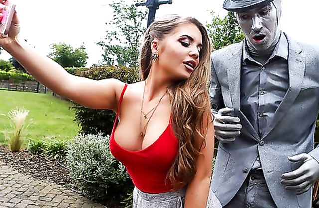 Beautiful girl reveals tits and shoves statue's big naked cock in pussy