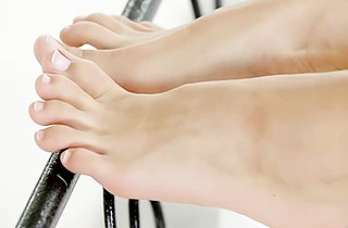 Naked brunette uses her smooth feet and pussy to please horny guy