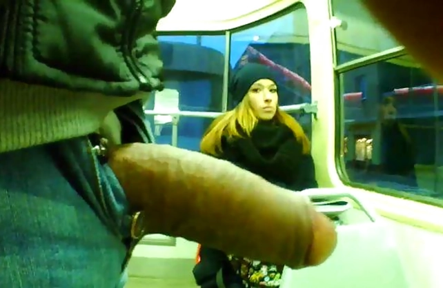 Curious girl in cap looks at naked cock of shameless bus passenger
