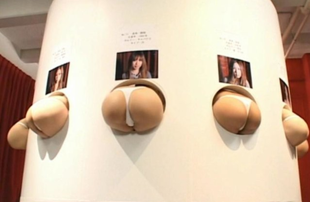 Masked Japanese guys have fun with girls' naked asses during TV show