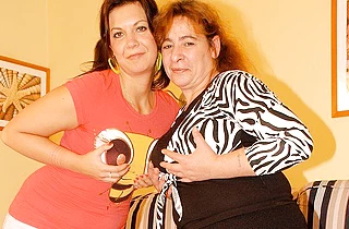 Naked fat woman moans loud because of lesbian lover straponing her