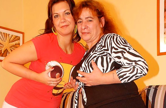 Naked fat woman moans loud because of lesbian lover straponing her