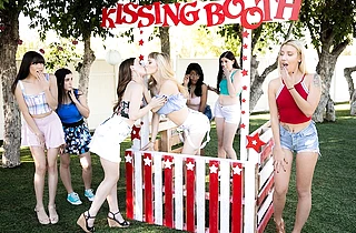 Blonde lesbian is fucking a redhead diving deep in her butthole with her tongue at the Kissing Booth
