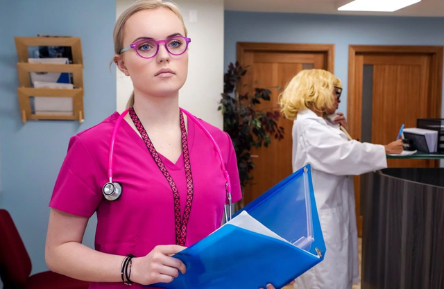 Beautiful nurse acts modest before turning into a slut alone with one of her patient