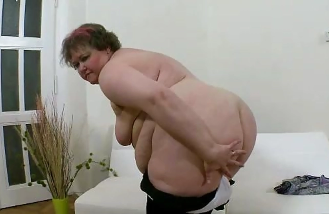 Sexy naked girl with humongous charms tries to reach and masturbate twat