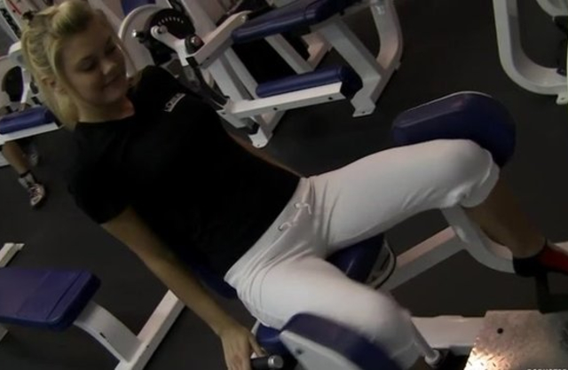 Beautiful naked girl comes to the gym to work out and pump her hips