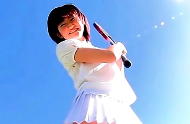 Oriental naked girl plays tennis and takes hot shirt off in the fresh air
