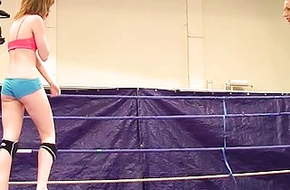Two slutty naked girls fight in the ring and slowly get naked for hot sex