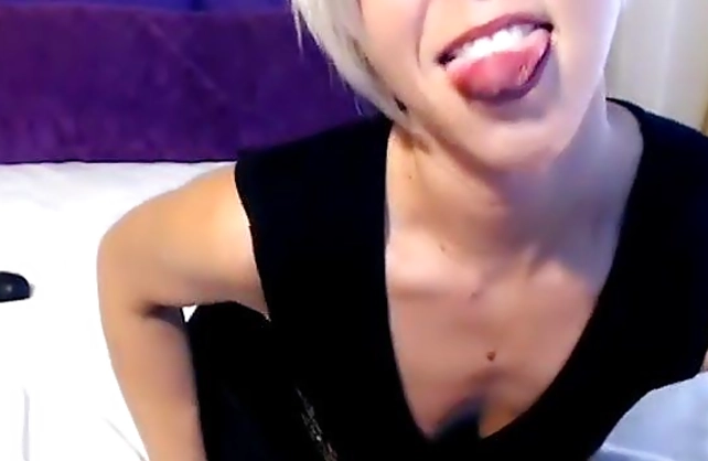 Milfy blonde with short hair sucks dildo in the non-naked video