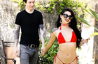 Pale stallion with tattooed naked body throws a leg to super-sexy Latina