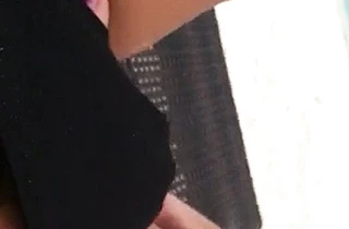 Excited girl with naked legs puts a hand in panties to masturbate
