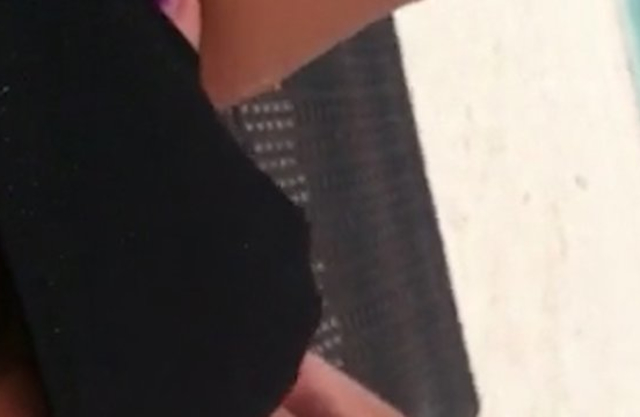Excited girl with naked legs puts a hand in panties to masturbate