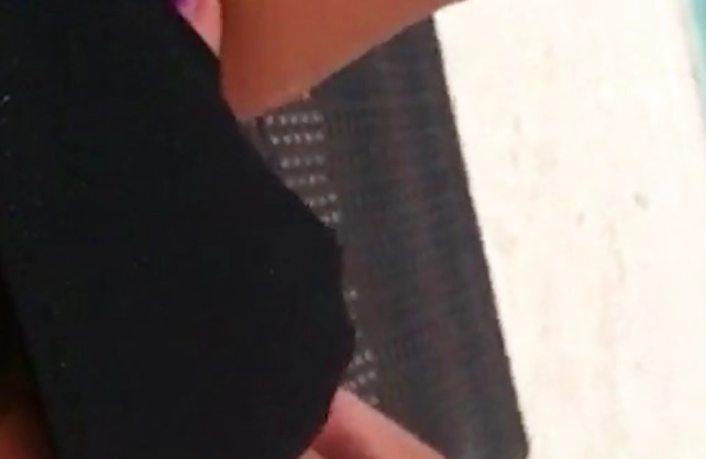 Excited girl with naked legs puts a hand in panties to masturbate