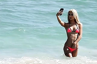 Stranger fucks the naked blonde with beautiful tanned body on the bed