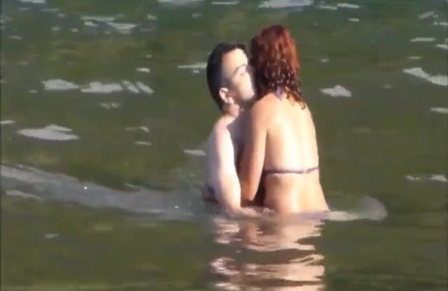 Red-haired wench and boyfriend are going to have naked sex in water