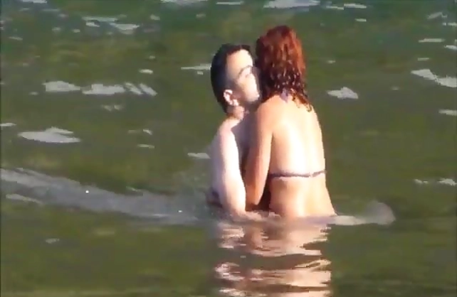 Red-haired wench and boyfriend are going to have naked sex in water
