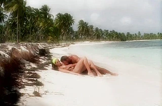 Delectable girl in acid green headband likes naked sex on the beach