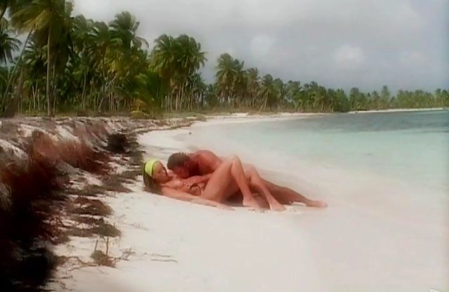 Delectable girl in acid green headband likes naked sex on the beach