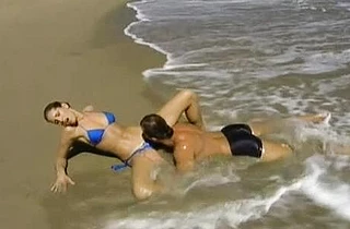 Splendid girl gives naked partner a blowjob after cunnilingus on the beach