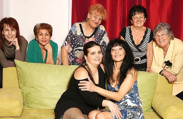 Guests watch naked sex between young babe and alluring mature pornstar