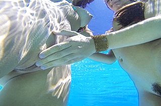 Nude girls making love in the pool