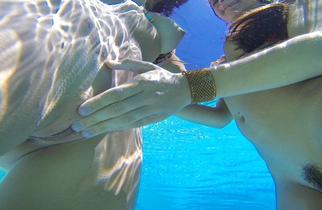 Nude girls making love in the pool