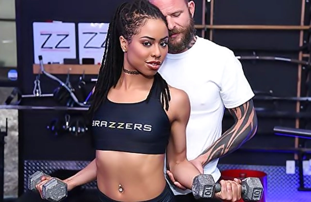 Sexy fitness girl with dreadlocks does an exercise called naked fuck