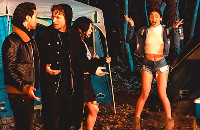 Camper in leather jacket fucks two naked pussies under cover of darkness
