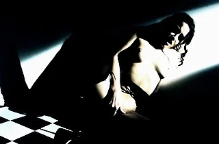 Sensuous housemaid in stockings stimulates naked pussy in the dark