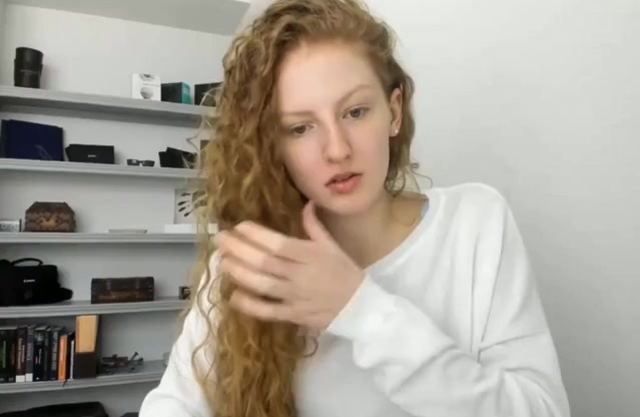 Curly-haired charmer demonstrates beautiful naked boobs and booty