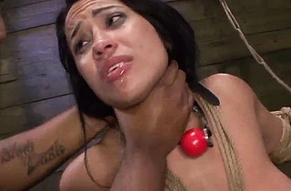Obscene girl performs naked BDSM show with master and fuck-machine