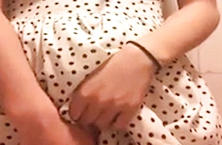 Not naked girl pulls up her sexy dress and rubs the clitoris with fingers