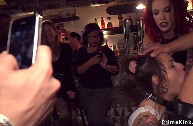 Two guys and sexy mistress punish young naked girl in crowded cafe